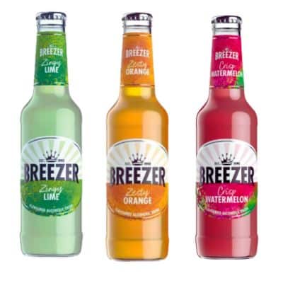 Three bottles of Breezer, showcasing the popular flavors Lime, Orange, and Watermelon.