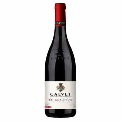 A bottle of Calvet Côtes du Rhône red wine with a dark red label and a gold emblem.