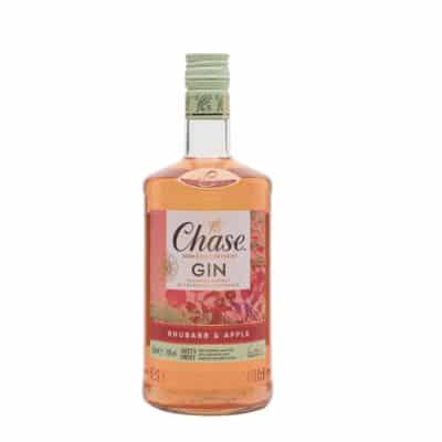 A bottle of Chase Rhubarb and Bramley Apple Gin 70cl with a glass of the gin and tonic, garnished with a slice of apple and a sprig of rhubarb.