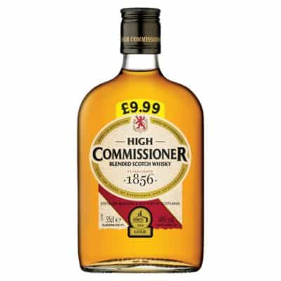 A bottle of High Commissioner Blended Scotch Whisky, a golden-hued spirit with a rich history dating back to 1856.