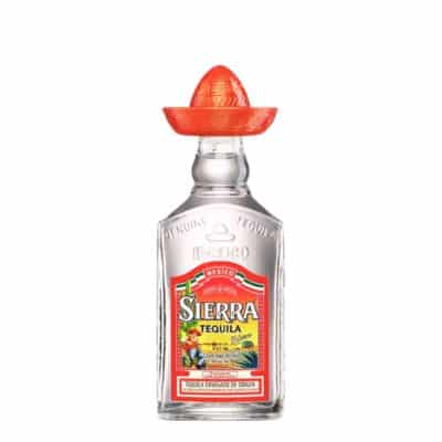 A bottle of Sierra Tequila with a small red sombrero on top.