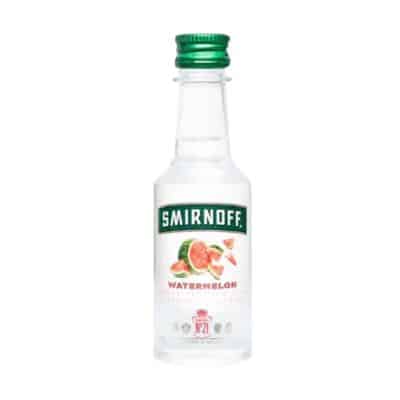 A miniature bottle of Smirnoff Watermelon Vodka with a green cap.