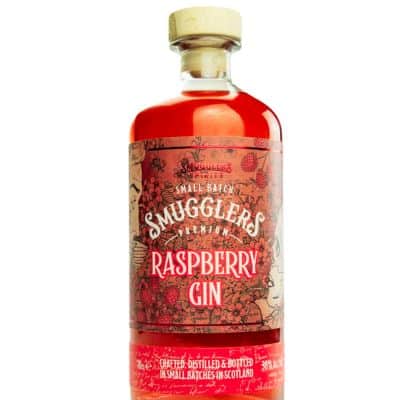 A bottle of Smuggler's Raspberry Gin 70cl with a glass of the gin and tonic, garnished with a raspberry.