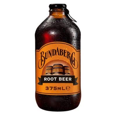 A bottle of Bundaberg Root Beer with a dark liquid and light tan label featuring the brand logo and product name.