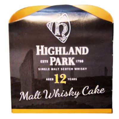 Highland Park Whisky Cake packaging, featuring the Highland Park logo, a silhouette of standing stones, and the text "Malt Whisky Cake."