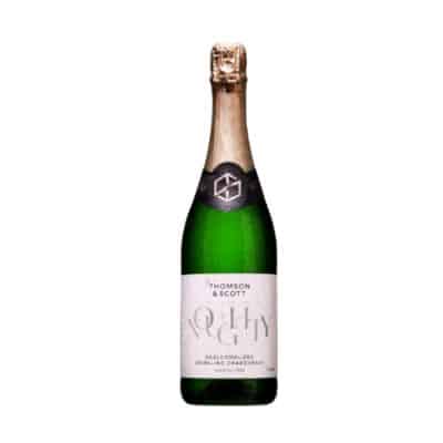 Noughty Non-Alcoholic Sparkling Chardonnay in a green bottle with gold foil, isolated on a white background.