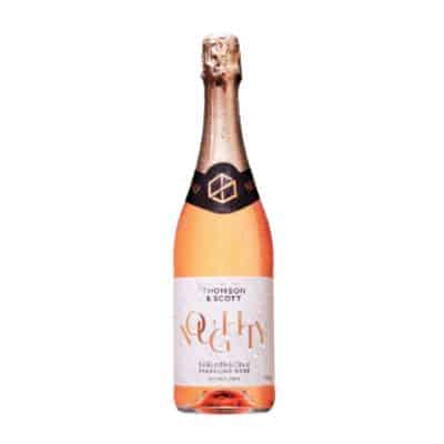 Noughty Organic Sparkling Rosé bottle, pale pink with gold foil, isolated on a white background.